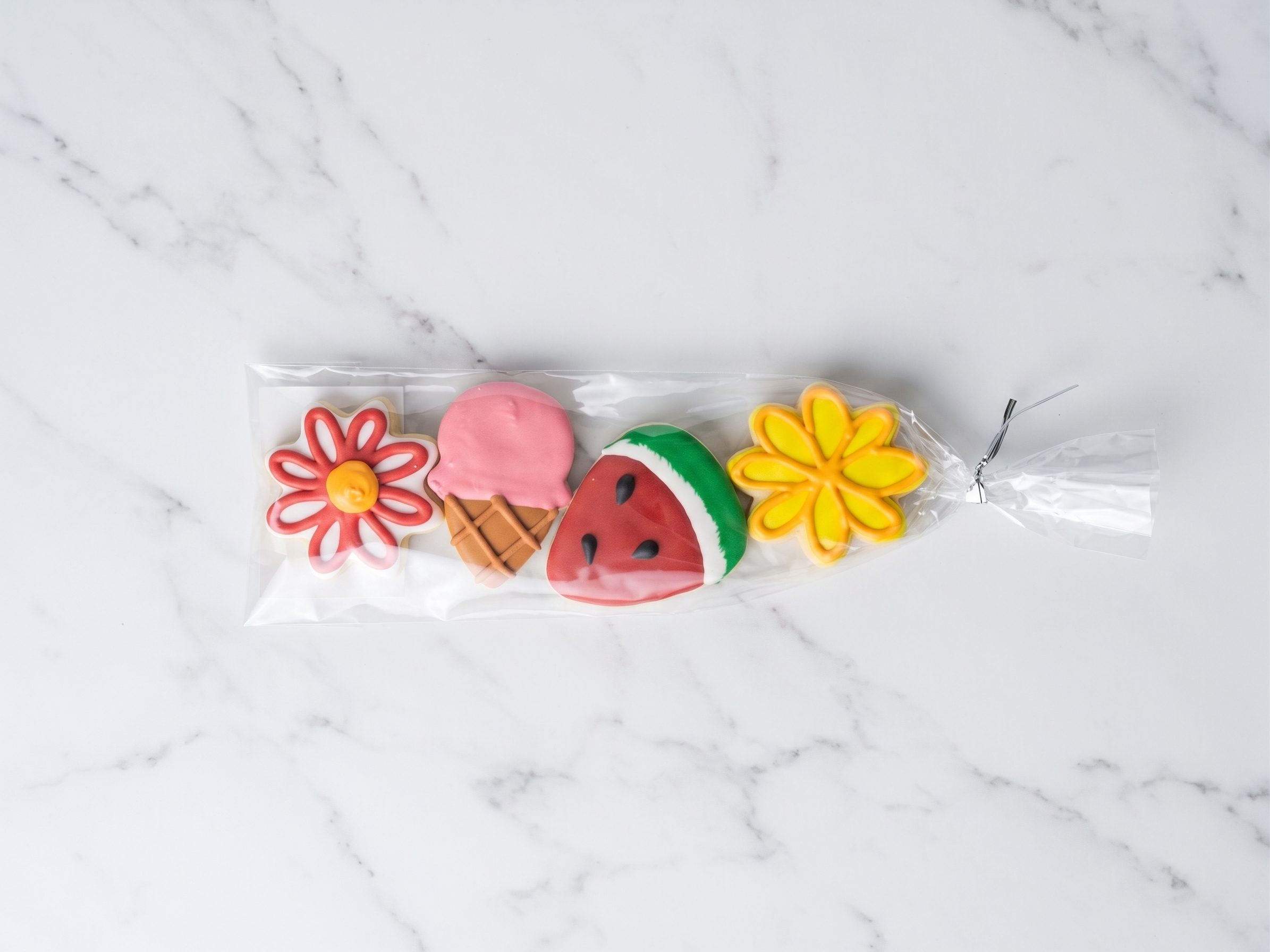 A white box with 4 sugar cookies