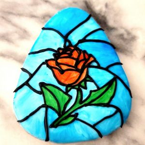 Stained glass rose royal icing cookie.